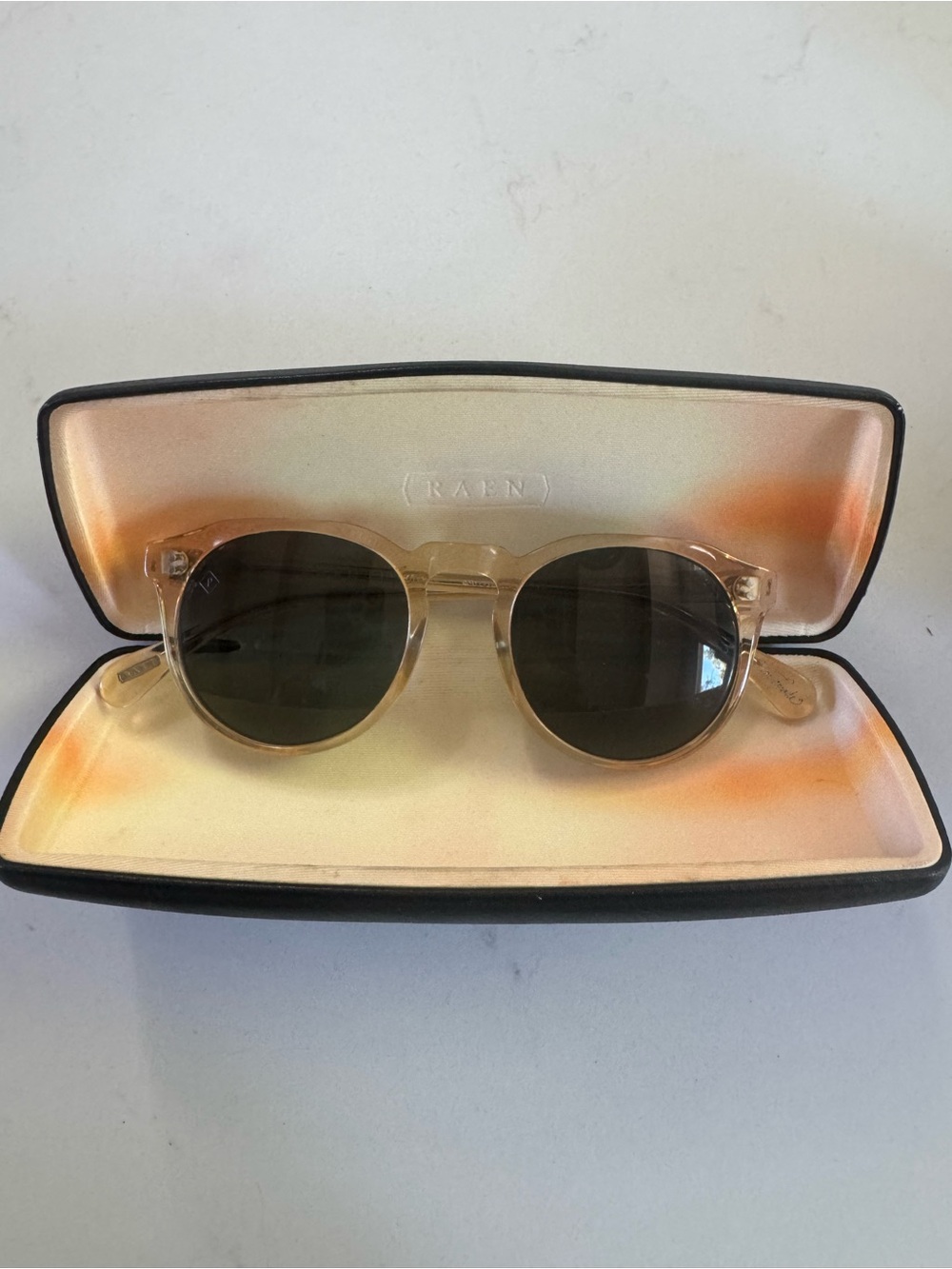 RAEN Remmy Sunglasses in champagne crystal with Dark Green Lenses